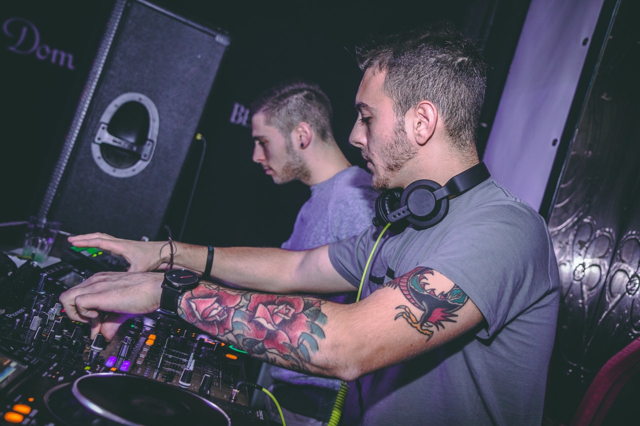 DJs mixing music in a bar
