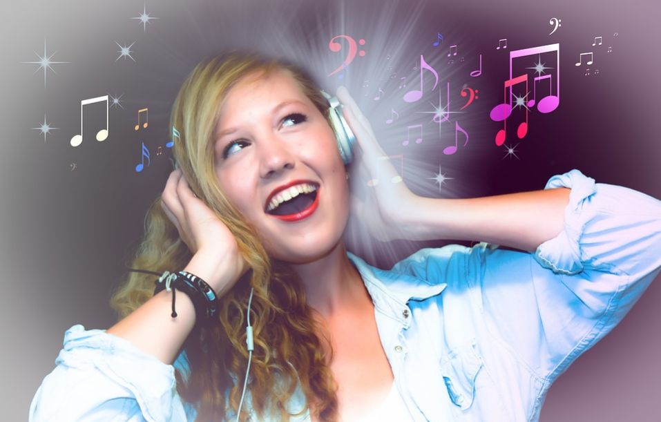 girl in blue longsleeve listening to music